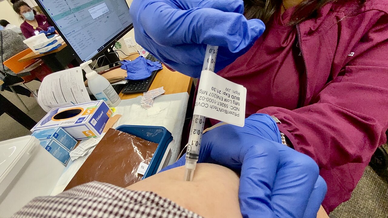 2019 novel coronavirus disease — COVID-19 —vaccination injection into an arm on March 18,