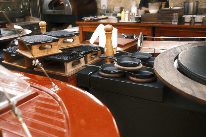 Kitchen setup showcasing grilling equipment and cooking tools at a busy restaurant undefined
